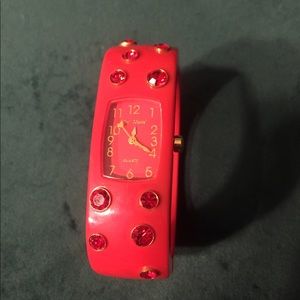 Red Betsey Johnson bracelet watch.